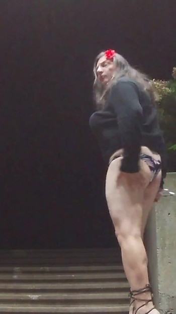 Iconic moment from "Sissy amateur milf CD outdoors in public at night solo masturbation with object in the ass"