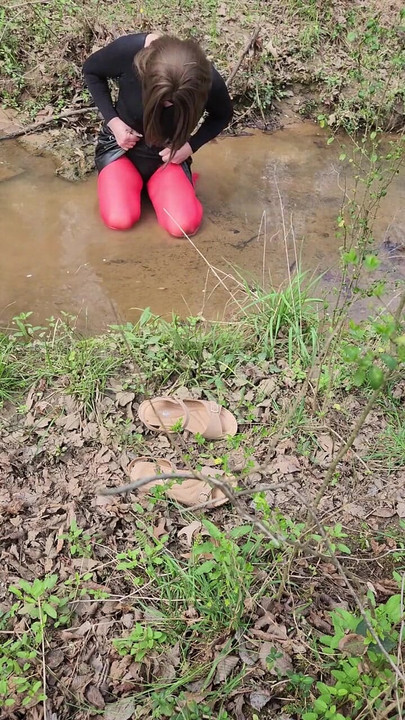 Must-see moment from "Crossdressed outdoors playing in a stream. Wearing pantyhose and miniskirt."