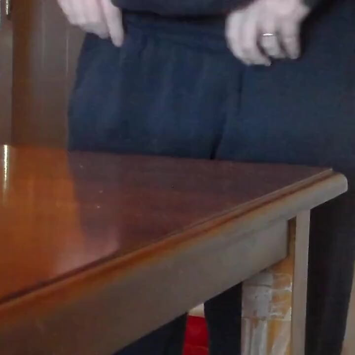John is pissing on the dining table