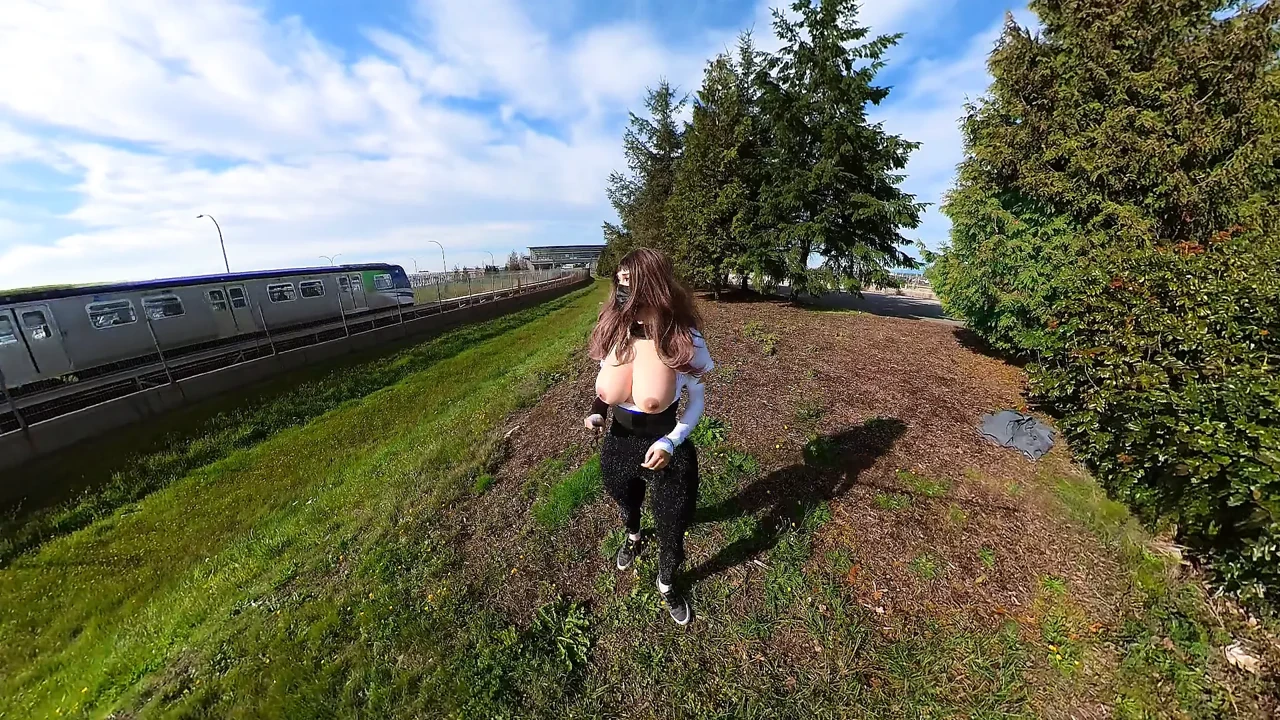 Crossdresser flashing huge boobs near train station