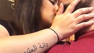 arabian couple kissing in public