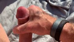 Stroking my hard cock in the field, stay tuned for more!