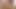 I would rephrase it as The pleasureful encounter between two lovers, one a young brunette, where they indulge in an intense and intimate act that satisfies their deepest desires and emotions.