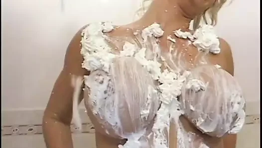 Guy licks MILF's cream covered tits before pounding her in the bathtub