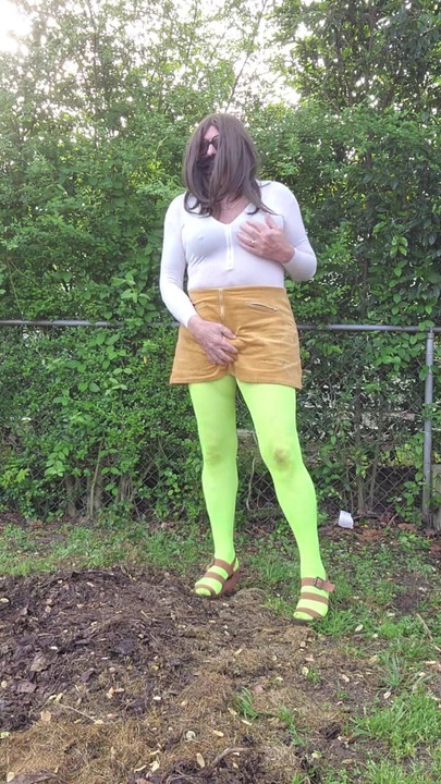 Stunning moment from "Gay crossdress tease, outdoors ground humping in pantyhose, black bra, miniskirt."