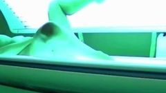 Sexy girl caught masturbating in the solarium