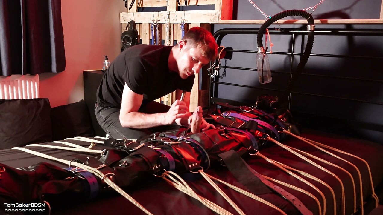 Edging the Boy in Leather Bondage but He Is Not Allowed to Orgasm