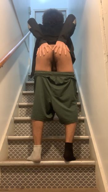 Lowering my shorts and showing my ass off at staircase