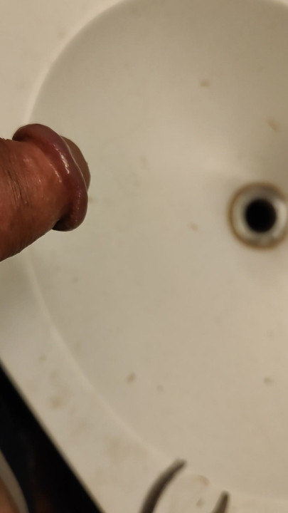 Pissing in a bathroom sink
