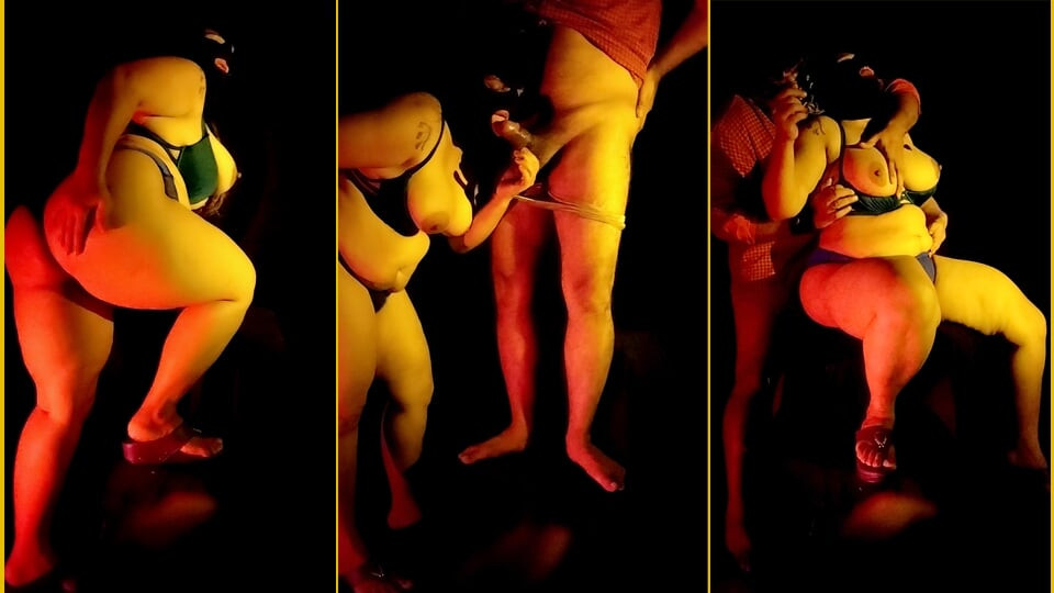 An Indian couple having intense sex in a dark room.