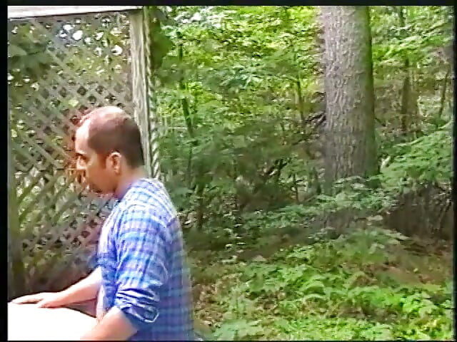 In the woods a dude blows his buddies after a shower