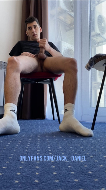 Captivating moment from "A GUY WITH HAIRY LEGS IN WHITE SOCKS ADIDAS JERKS OFF A DICK"