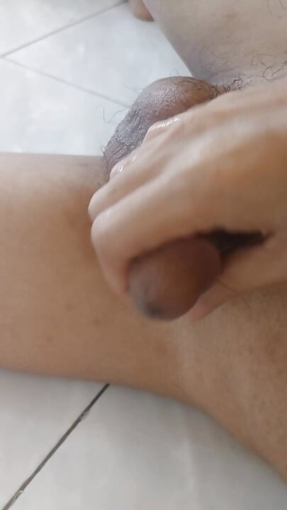 handsome asian guy jerking off in his office