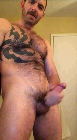 hairy tatted straight man pumps out a load