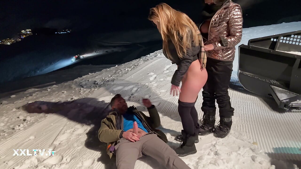 Nighttime ski slope threesome