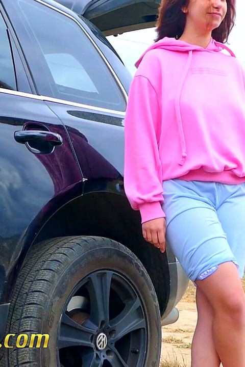 Pee next to the wheel of the car