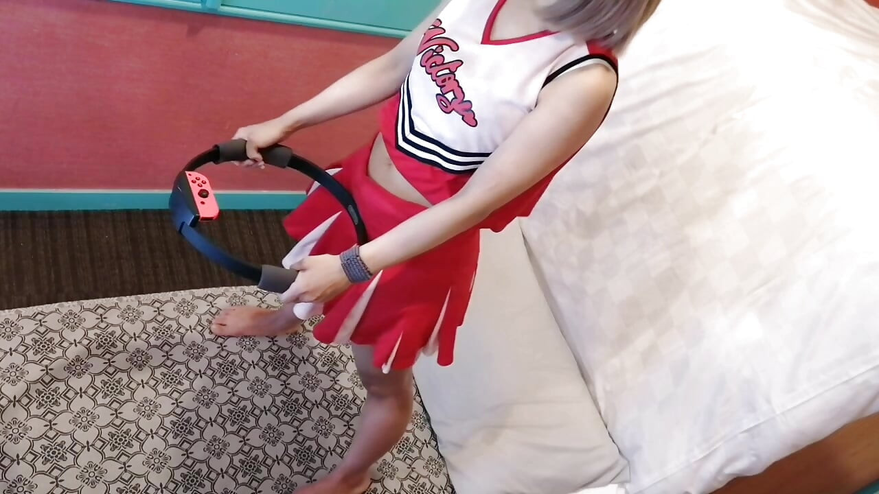 A cute, busty married woman performs exercise 4 in an erotic cheerleader costume. Peeking down from above. Home made amateur Private Shoot