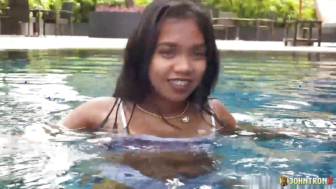 JohnTronX - Gorgeous Thai babe swims in the pool and gets that underwater D