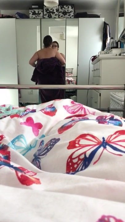 Samantha taking off her robe