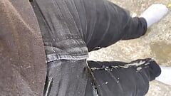 Pissing my black jeans outside