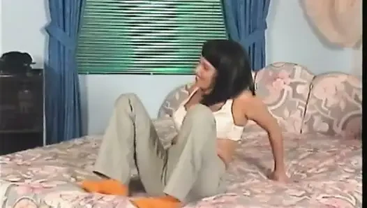 Big titted milf is filling her pussy with a dildo