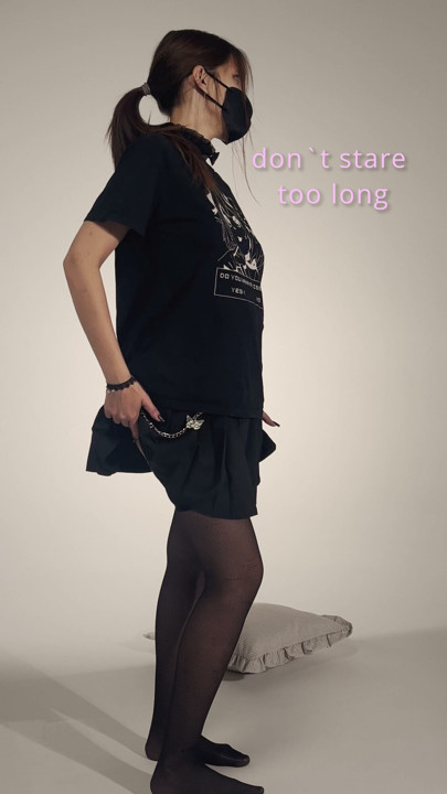Faceless masked girl lifting black miniskirt – slow tease