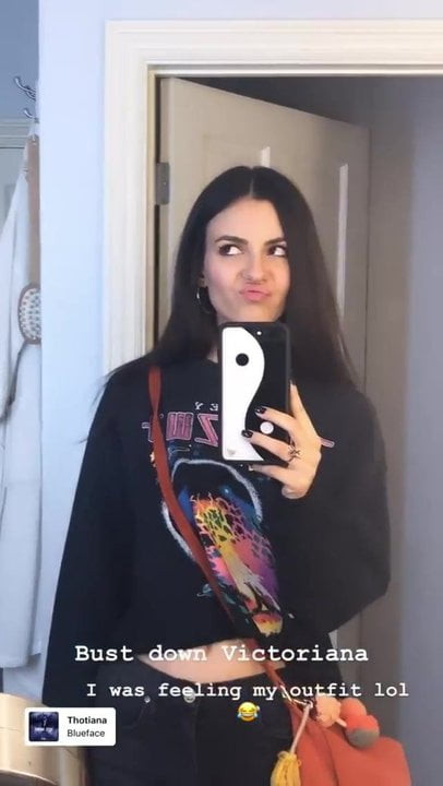Victoria Justice in black shirt and pants.