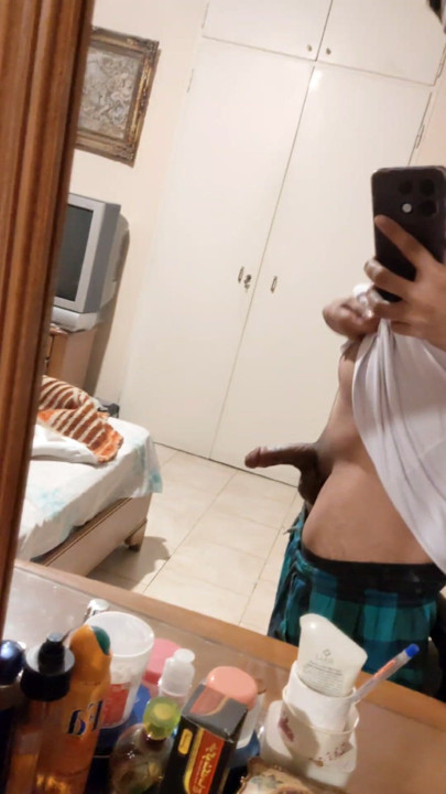 The Iranian boy shows him in front of the mirror and squeezes