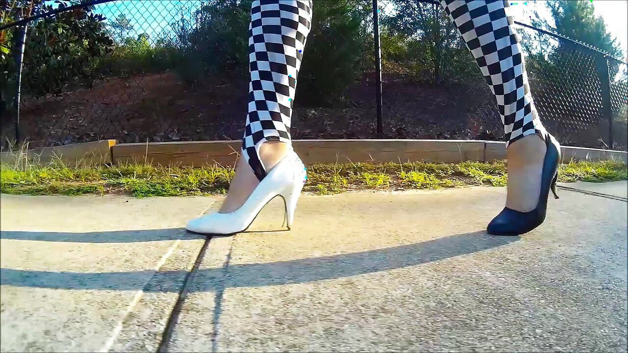 Crossdresser Walking in a public park in high heels
