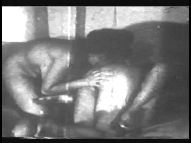 Grainy black and white footage of woman with nice boobs fucking and sucking