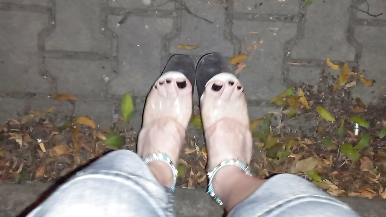nighttime crossdressing on a public street in 20cm stripper heels, black toes, and black claws