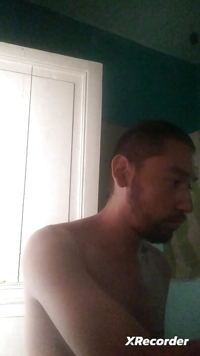 Man does his skincare in the morning