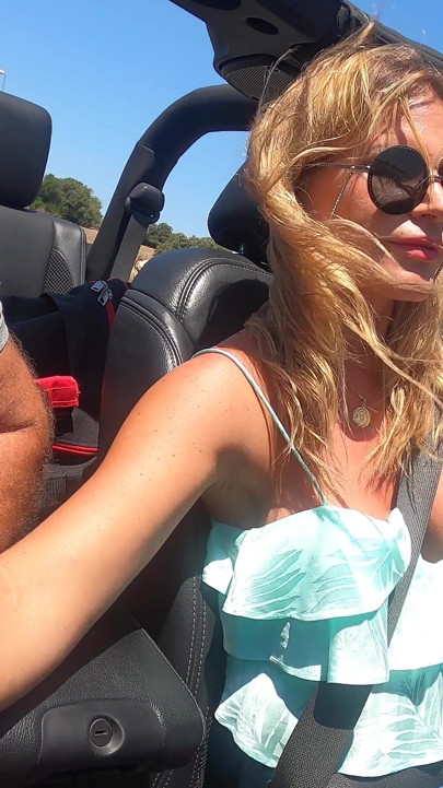 Busty Blonde MILF Gives Road Head While Driving