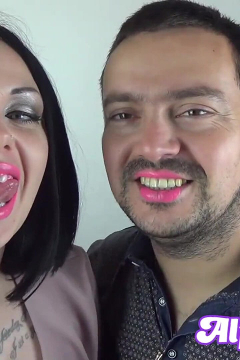 Covering Alex with pink neon shiny lipstick while kissing all over his face