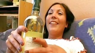 Hot German girl with big tits stuffing a bottle in her shaved pussy