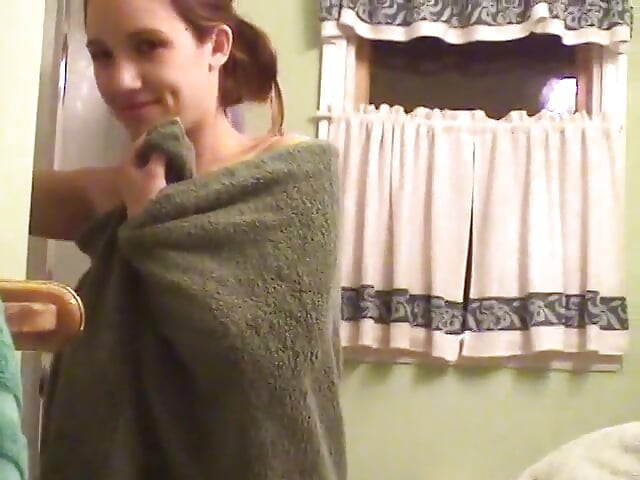 Cute brunette teen soaps up in the shower and takes time to trim her bush