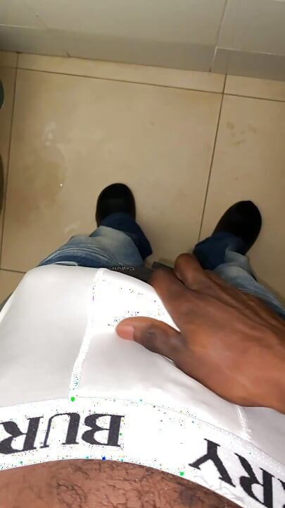 Thug beating his meat in the office