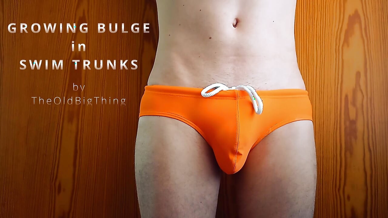 growing bulge in orange swim trunk - what every boy fears and girls dreaming of
