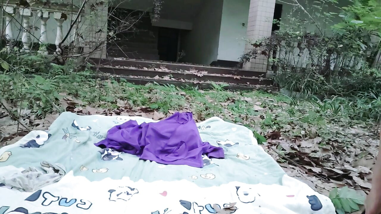 A mischievous Asian boy masturbates, moaning and ejaculating in the atrium garden of an abandoned hotel