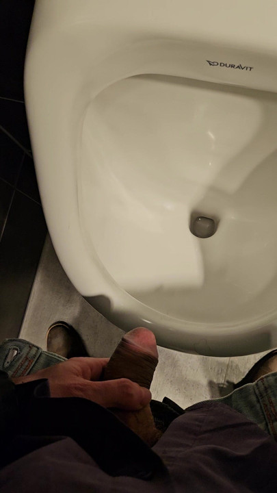 Pissing on public hotel toilet