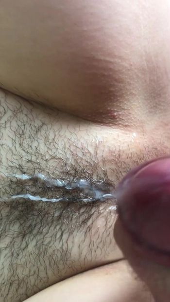 Cumshot on hairy pussy