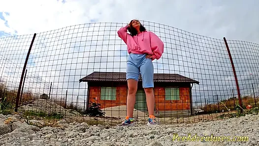 Hipster girl pee in her jeans - changing her wet shorts into dry pants