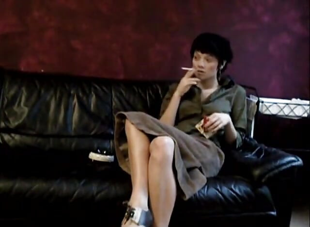 Black haired teen smoking a cigarette