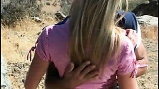 Muscled man gets frisky with hot girl in a desert