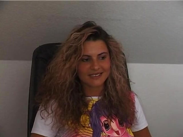 Gorgeous curly haired babe masturbating in solo video