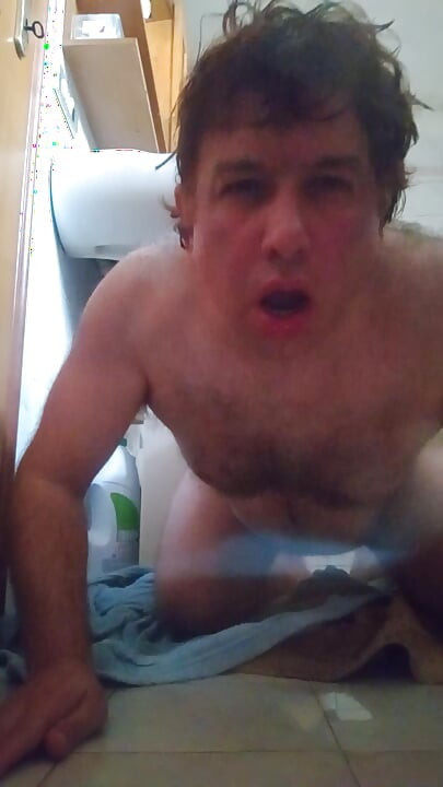 Wet guy after taking a shower masturbates by peeing in the final
