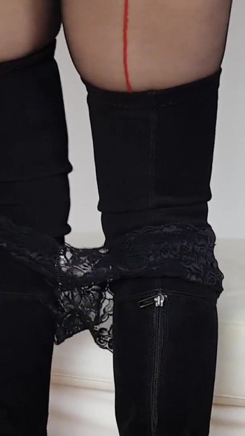 Captivating moment from "Ainoa teasing boots, miniskirt leather, boobs, full nyloned"