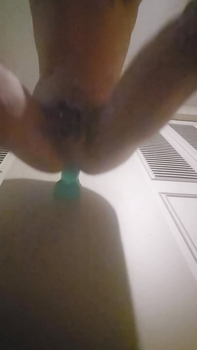 Caged sissy taking huge dildo