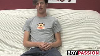 Adorable gay guy Danny jerks off his dick on couch solo