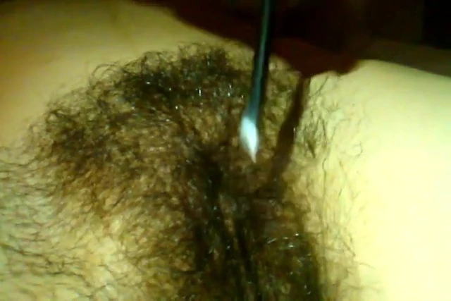 Wife grooming her hairy pussy